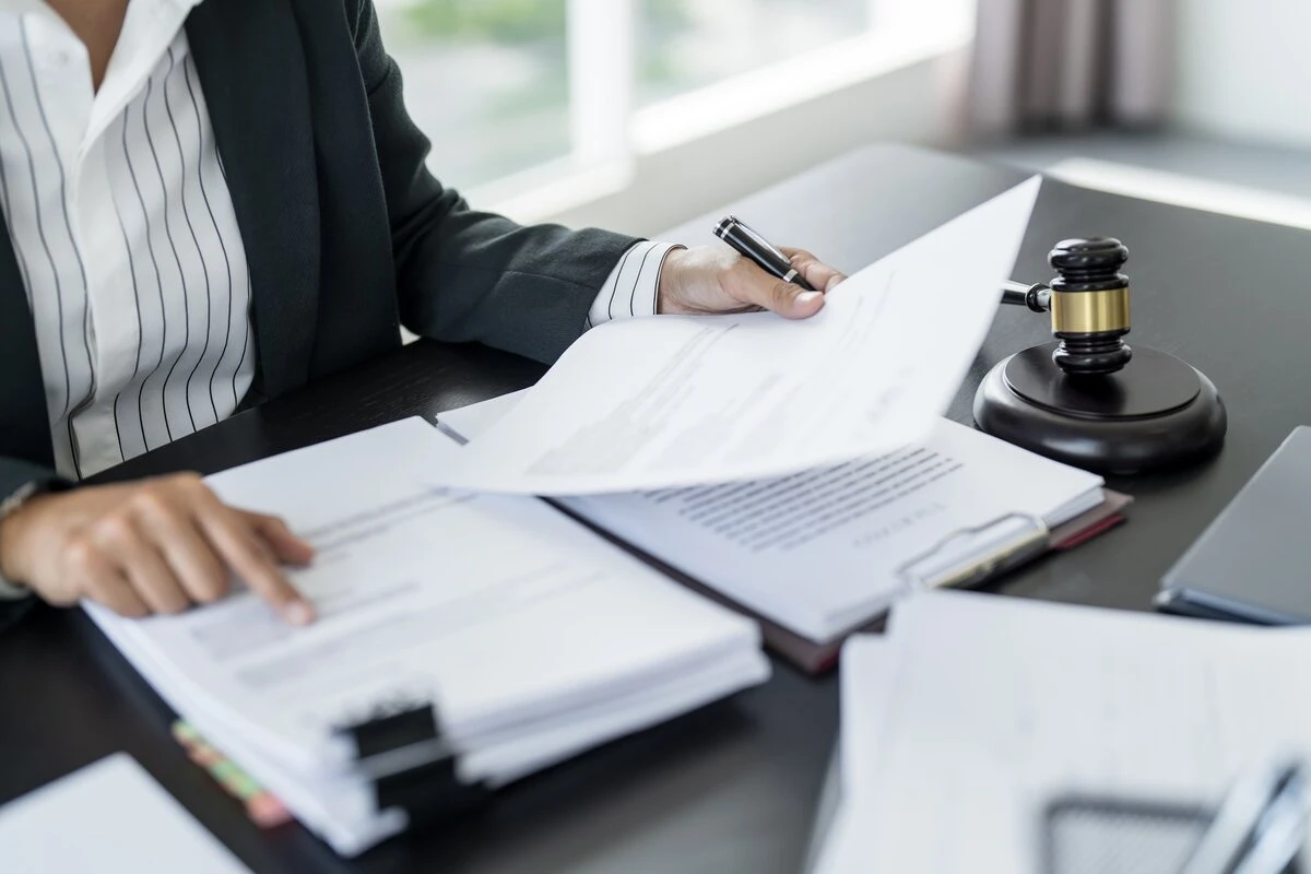 A professional bail bondsman assisting a client with paperwork, ensuring a quick and stress-free release with California Bail Bonds' 24/7 services.